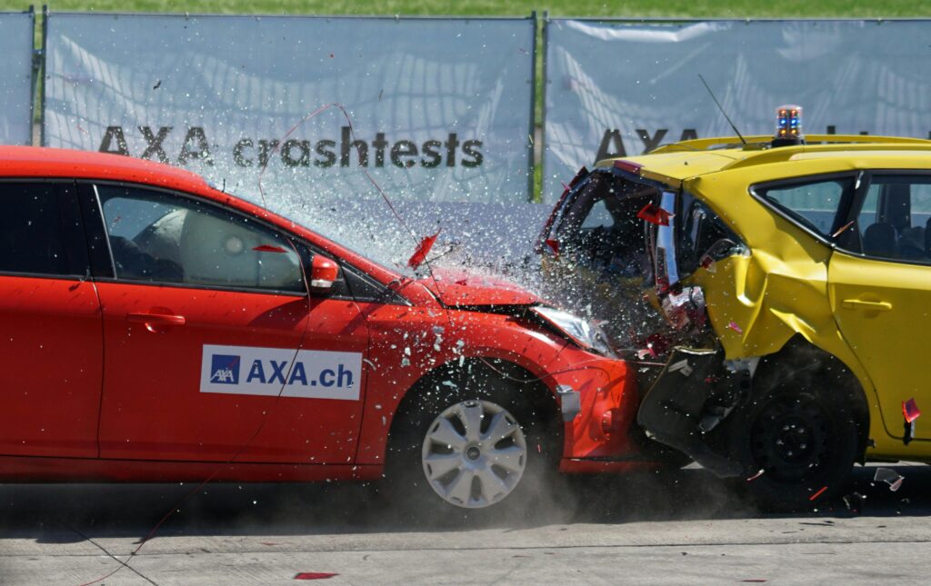 crash-test-collision-60-km-h-distraction-163016-163016 Red and yellow cars shown in a head-on collision during a crash test for safety evaluation.